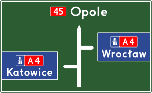 Znak E 1b.svg  300x184 Znaki drogowe   kierunku i miejscowości